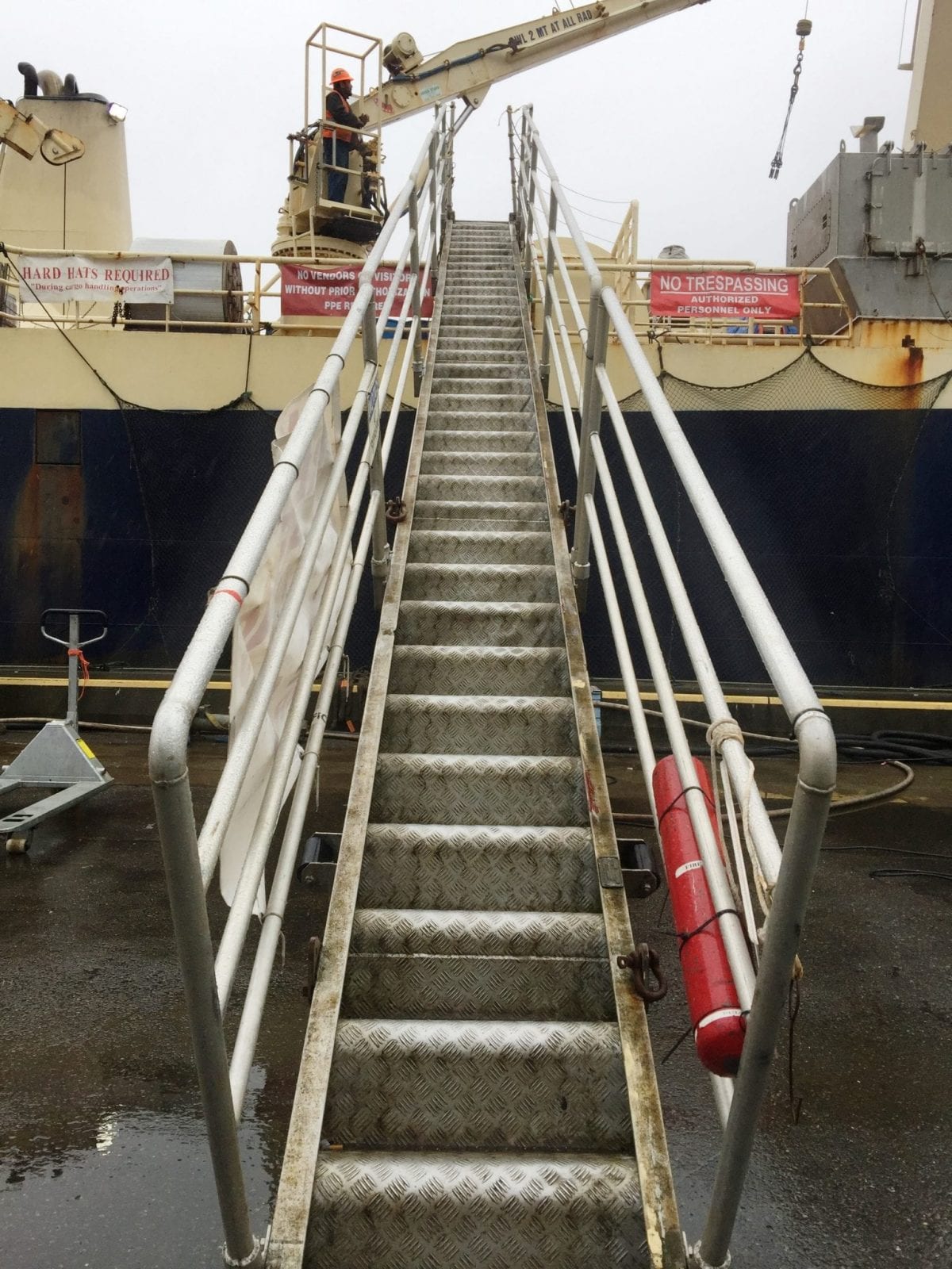 stairs going up to water vessel on dock